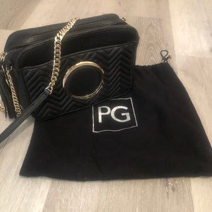 Purificación Garcia Black it can also be as a crossbody bag 6” Height  8.5” Wide